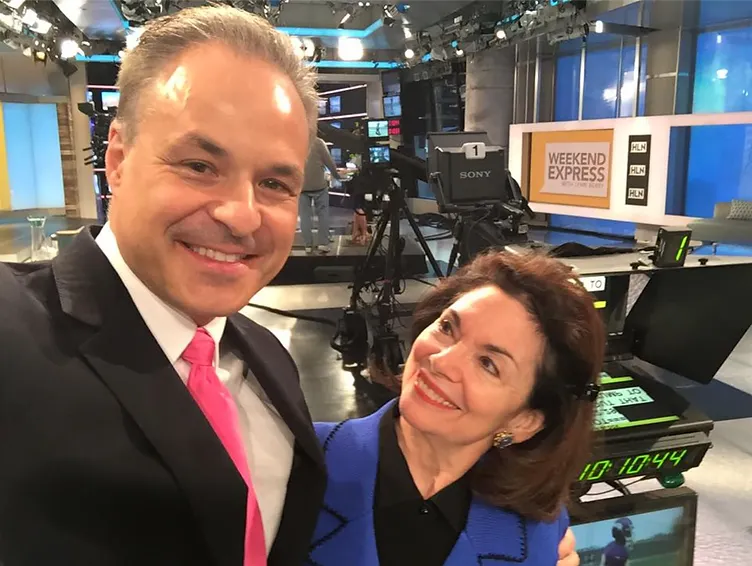 Two people in a broadcast studio