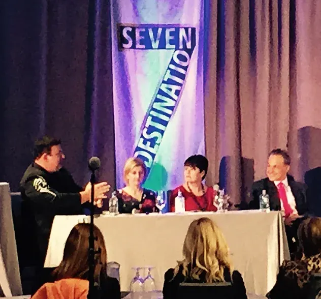 Four people speaking at table