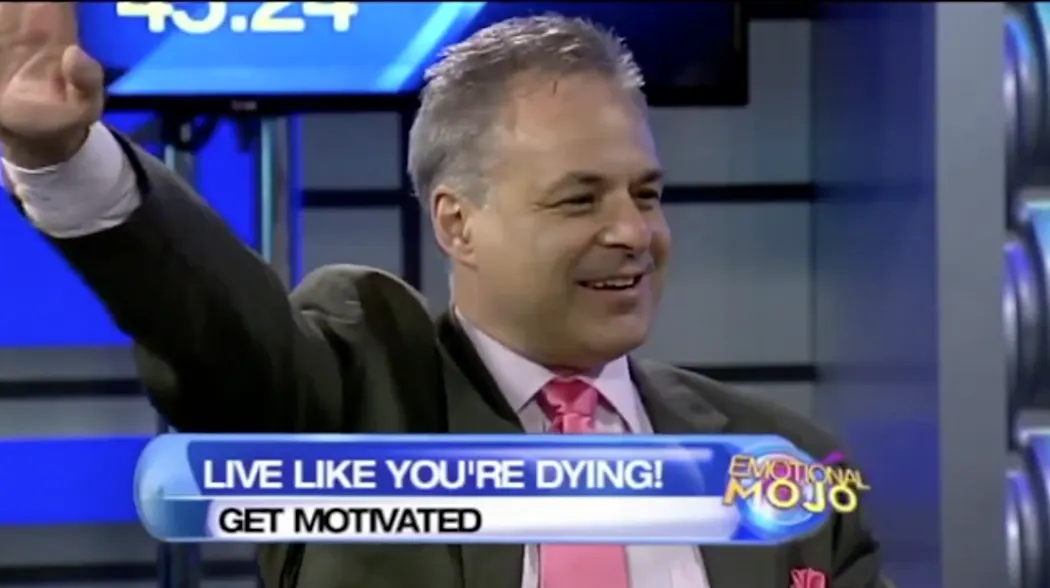 Man smiling on TV talk show