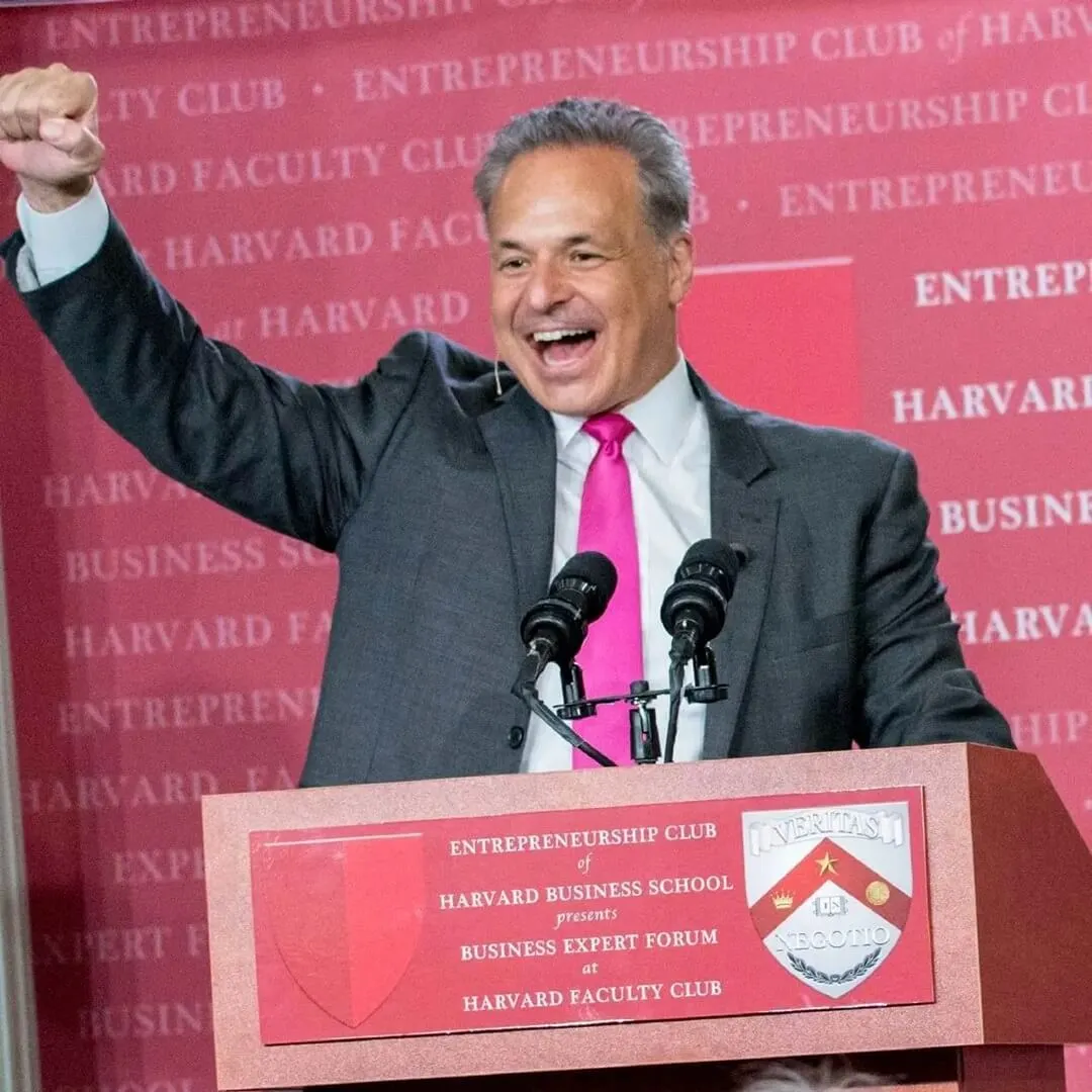 Enthusiastic presenter with raised fist