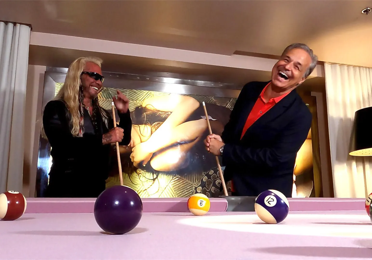 Colorful pool table with joyful players